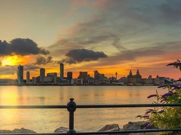 Liverpool skyline across the Mersey at sunset